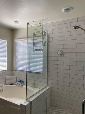 After - fresh subway tiles for shower and tub wall surround with penny round tiles in the shower flooring