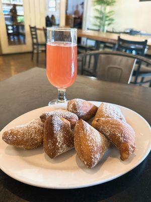 Mimosa and 'pile' of beignets