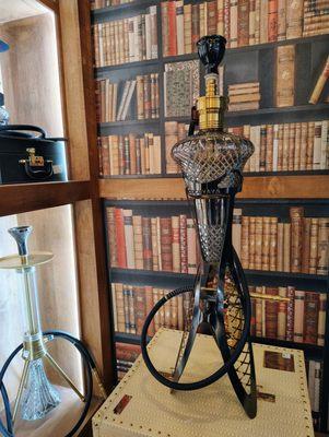 This hookah stands 46 inches tall and has a stainless steel stem. It's a great size for a party.