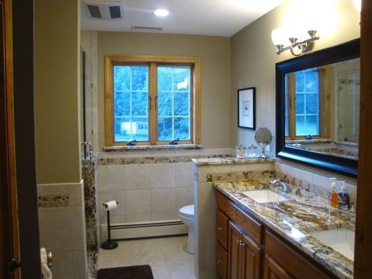 AFTER: A complete bathroom renovation with a custom shower pan and detailed finish work