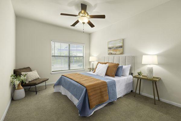 Bedroom with ceiling fan at Onion Creek