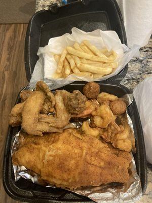 This is the special of the day. Two big pieces of fish. Shrimp, hush puppies and fries for $25