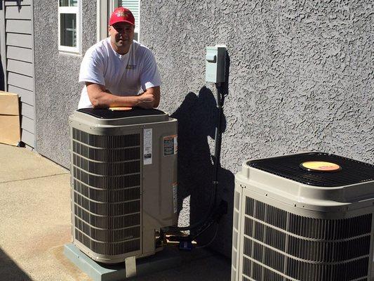 Eric standing by two newly installed Bryant Evolution air conditioning units (Granite Bay Ca)