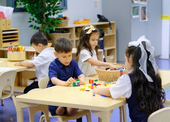 Elementary students enjoying classroom table activities