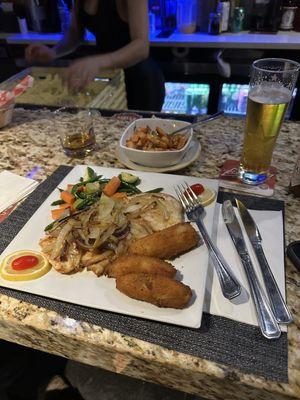 Garlic Shrimp Appetizer, accompanied by a grilled chicken breast with grilled onions.