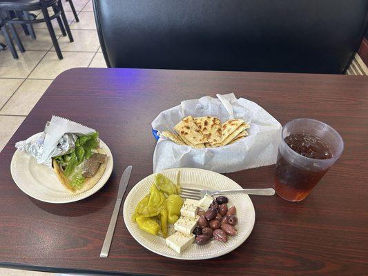 Peppers, cheese, and olive appetizer with fresh pita bread