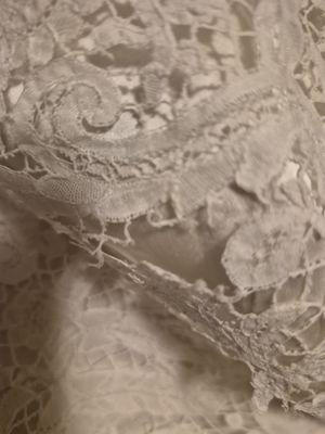 torn lace on breast area