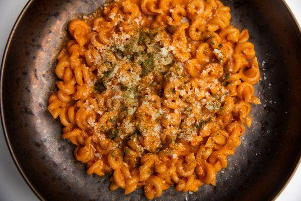 Makhani Trottole, with inspired spicy tomato gravy, grana padano and dried curry leaf