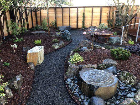 Crushed Rock Pathways with Stone and Redwood Benches