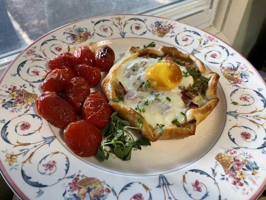 Onion and ham galette with blistered tomatoes