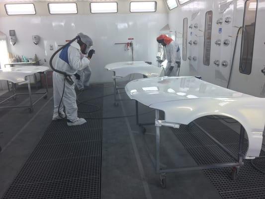 Environmentally friendly waterborne paint is used in a controlled booth