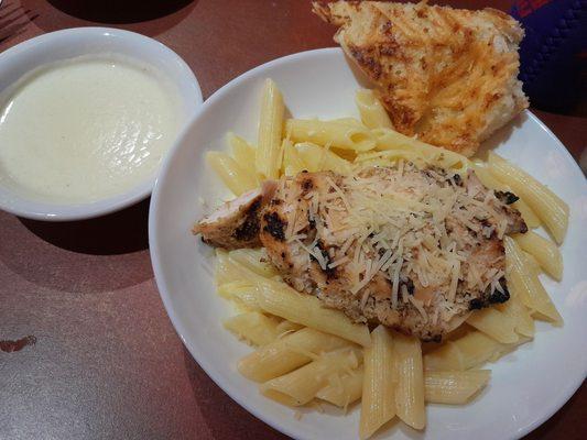 Senior chicken penne alfredo with an extra side of alfredo sauce and that awesome cheesy garlic bread.