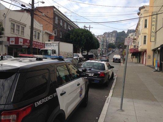 View of street directly in front of the garage. 4 more cop cars behind the camera. Felt safe leaving my car here as a tourist.