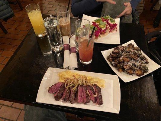 Steak and eggs, brussels sprouts with parmesan, tacos. Spicy Bloody Mary, coffee, pineapple juice.