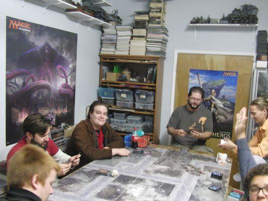 Crazy magic people playing on a Warhammer table.