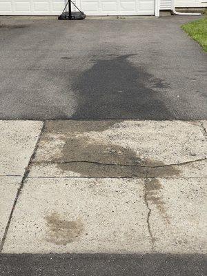 Oil stained driveway two days after having an oil change at Valvoline