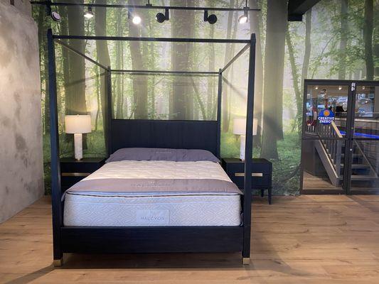 Naturepedic Organic Elysium Mattress displayed in a beautifully crafted modern canopy bed frame