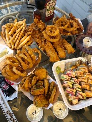 Fish and chips, Zucchini, onion rings, 2 sushi rolls.