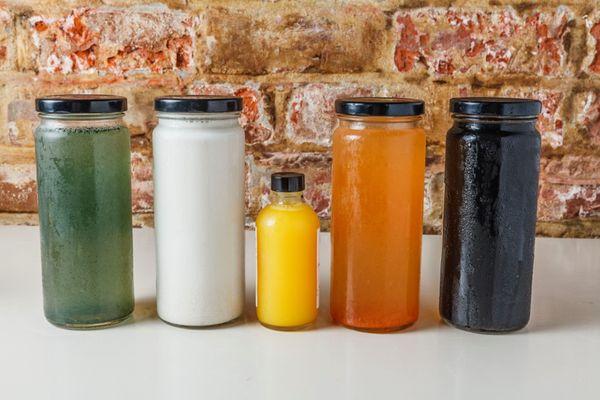 Freshly made cleanses in glass jars