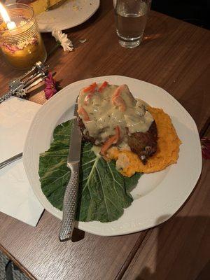 Smothered pork chop with mashed sweet potatoes