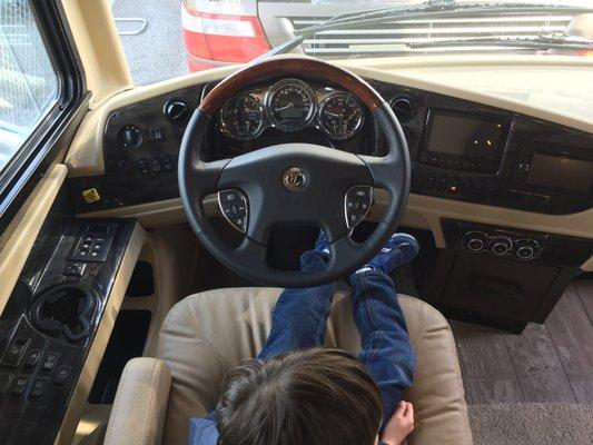 My son at the helm of the 1/2 million dollar Tiffin motorhome.