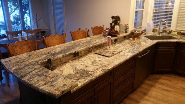 Lake Tahoe cabin kitchen counter tops with bar top, stainless steel sink, under mounded sink, windowsills, Pencil Edge and cutting board.