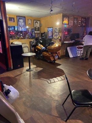 Motorcycle parked inside the bar.