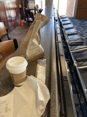 Charging stations are behind the coffee stand at Concourse B