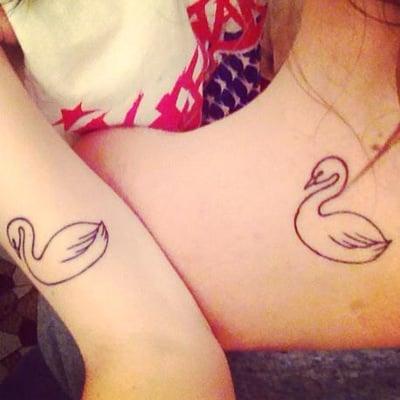 Matching swan tattoos by Nick.