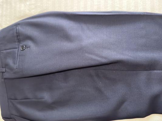 Improperly sewn and fold on the side of the pants