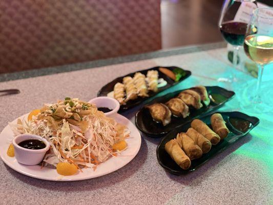 Asian salad, potstickers, egg rolls and fried shrimp with house aioli