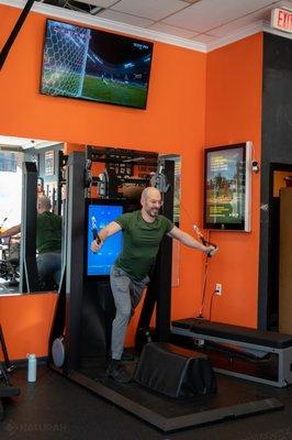 Mike pumping iron and sculpting his chest with precision and control using the chest fly exercises on the Oxefit XS1.