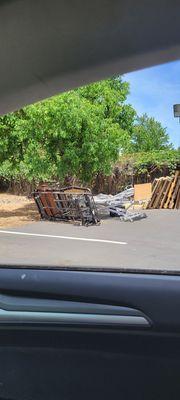 Pile of hospital beds and broken wheelchairs