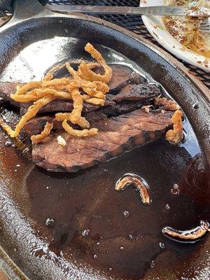 Overcooked sliced steak