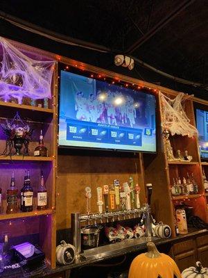 Fun Halloween decor. Tvs above the bar. 1 of the tap area. I think there was 2