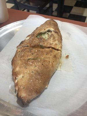 White sauce calzone with several toppings. Are they toppings if they are on the inside???