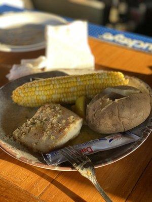 Mahi mahi with baked potato and corn