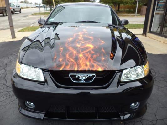 Ford Mustang with Roush front bumper & Cobra R hood installed with custom painted flames.