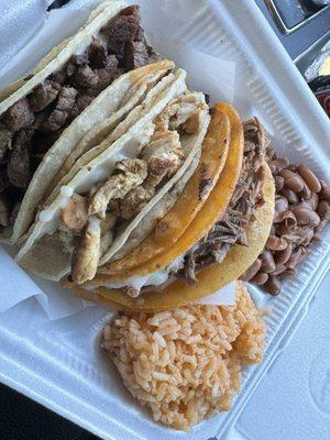 Three taco plate.  Asada Taco, Pollo Taco, Birria Taco, rice and beans.