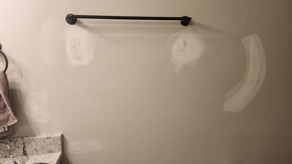 After having been torn from the wall this towel bar was reinstalled and repairs made in about an hour.