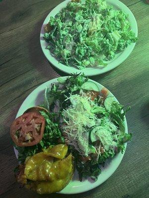 Bbq bacon burger with side salad and a Caesar salad.