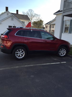 This is A cherry red jeep Cherokee latitude 2015