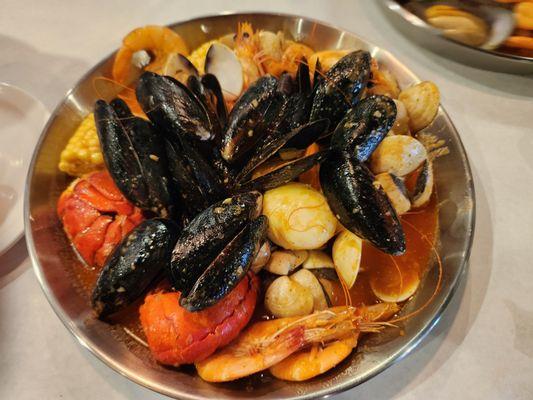 AYCE with lobster (1st order only), mussel shells , boiled eggs, clams, corn, head on shrimps with combination sauce