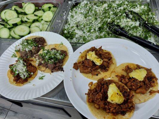 The tacos on the right are Al pastor with pineapple on top..  so good.