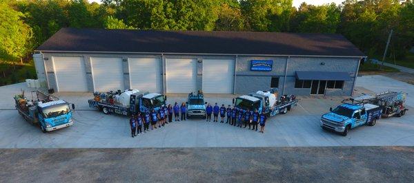 Uniformed team members and professional wrapped trucks ready to serve.