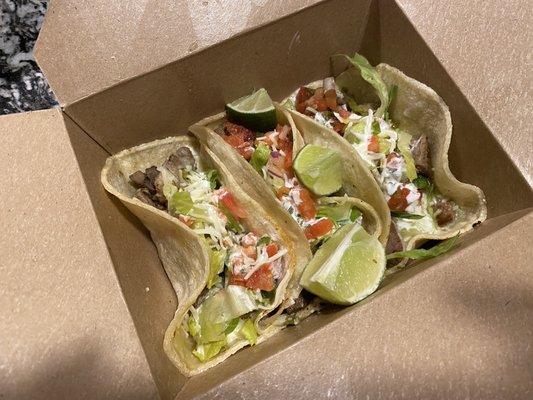 Steak tacos (added cheese, sour cream, pico de gallo, and lettuce.