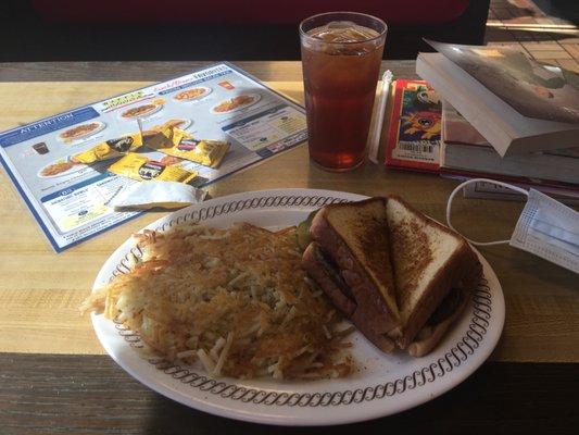 The perfect lunch! Texas Bacon Patty Melt Plate With Hashbrowns and a side of Sweet tea.