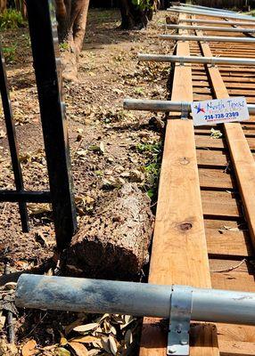 Six posts set about 10" into the ground for a 7' privacy fence.  No concrete.  Ridiculous.