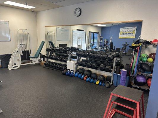 Dumbbell rack with kettlebells and plyo-boxes.