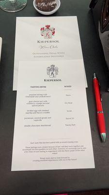 Food and wine tasting class menu with bottled wine prices on the back